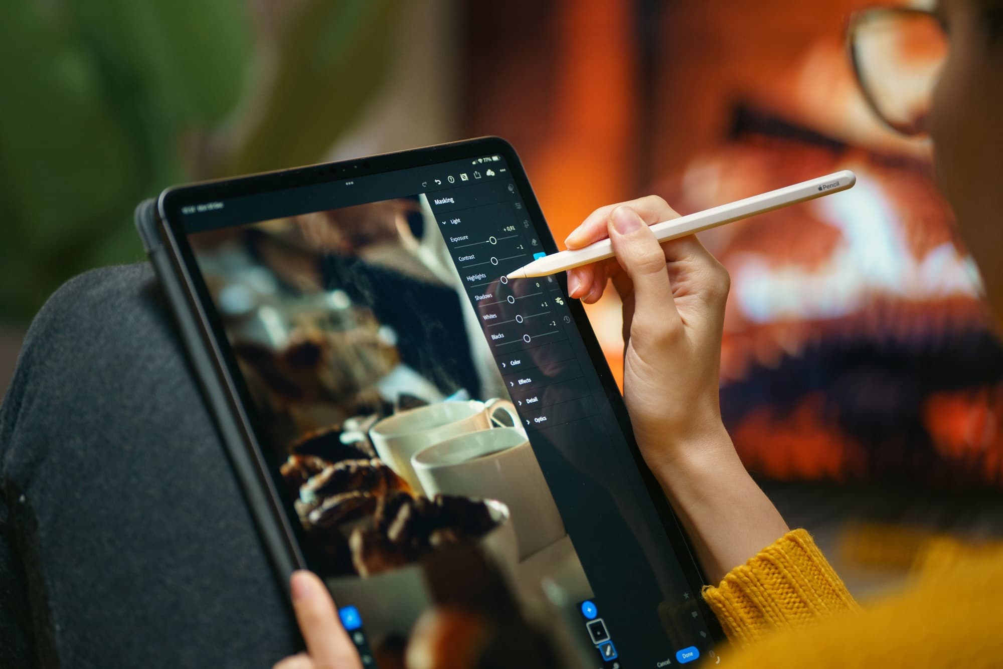 A creator filming herself at home on a tripod-mounted camera